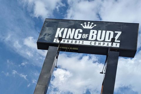 A black sign for King of Budz cannabis store