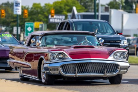 Cruisers show at Woodward dream cruise. In front is a red classic car