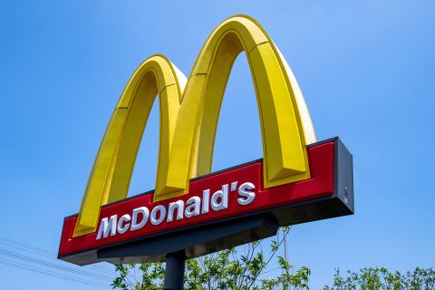 McDonald's burger fast food restaurant. Sign, logo, angle view