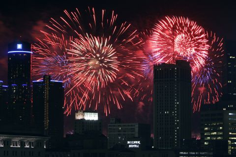 Red and blue fireworks in the sky. 
