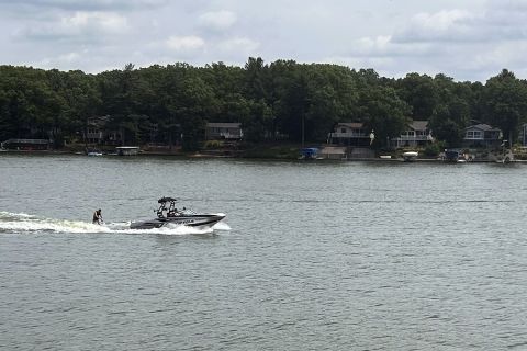 Wakeboarder goes across Brooks Lake in Michigan.
