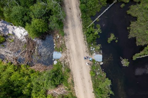 An aerial view of crews working on a culvert