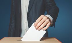 man with ballot