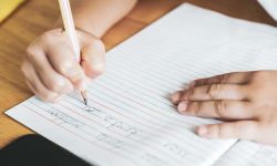 child doing cursive