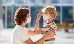 mom with mask on put mask on child