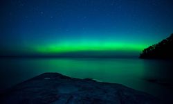 Northern lights appear over Miner's Beach in the pictured Rocks National Lakeshore.