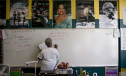 teacher writing on whiteboard