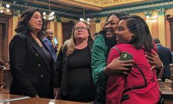 Sarah Anthony hugs person next to her