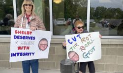 Protestors holding signs