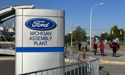 people in front of the ford assembly plant