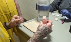 a close up of someone's hands holding medicine 