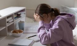 Girl is stressed at desk