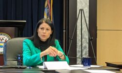 Michigan Attorney General Dana Nessel on a table