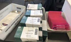 bundles of absentee ballots at a Michigan post office