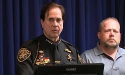 screenshot of Oakland County sheriff Michael Bouchard and the mayor of Rochester Hills at the podium at a June 15 press conference