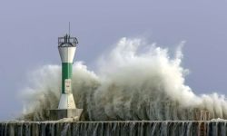 Large waves crash into the navigation and pier on the shores of Lake Michigan