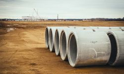 water lines are in foreground. Trucks are in the background