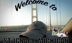 Welcome to St. Ignace postcard. You can see a Bridge hat on the foreground and the Mackinaw Bridge in the background