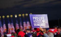 Someone holding sign for Pro-Life Voices for Trump