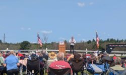 Republican U.S. Senate candidate Mike Rogers on the stage, talking to a crowd