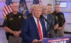 Donald Trump speaks into a microphone at an event in Michigan