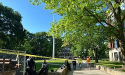  Police sit on the University of Michigan Diag, which was surrounded by caution tape