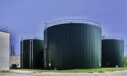 Three green silo-looking structures. It's the shuttered biodigester in Fremont, Michigan