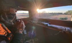 Erik Schnelle, wearing cameo, is sitting in his deer blind