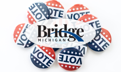 Bridge Michigan logo in the foreground, vote buttons in the background