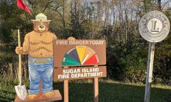 Smokey the Bear show a very high fire risk. The sign is outside the Sugar Island Fire Department