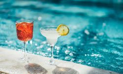 Two cocktail near swimming pool