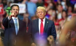 JD Vance and Donald Trump stand next to each other at a rally