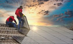 People working on a solar roof