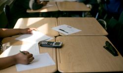 A student working on a math problem in a classroom