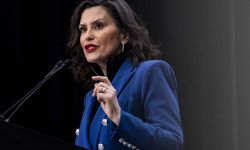 Michigan Gov. Gretchen Whitmer speaking into a microphone. 