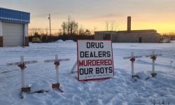 A sign that says "Drug Dealers Murder Our Boys."