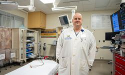 Dr. Brad J. Uren in a medical office. 