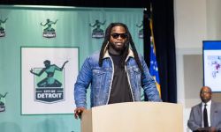 Dujuan ‘Zoe’ Kennedy, executive director of FORCE Detroit, speaks into a microphone