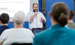 Man speaks to crowd