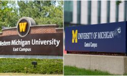 Signs for the Western Michigan University and the University of Michigan.