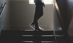 A student in a high school stairwell