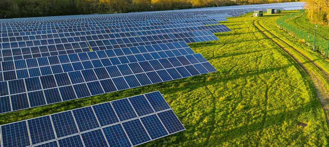 Solar farm; a row of solar panels outside